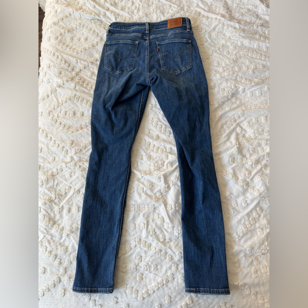 Levi’s 721 in distressed dark wash.